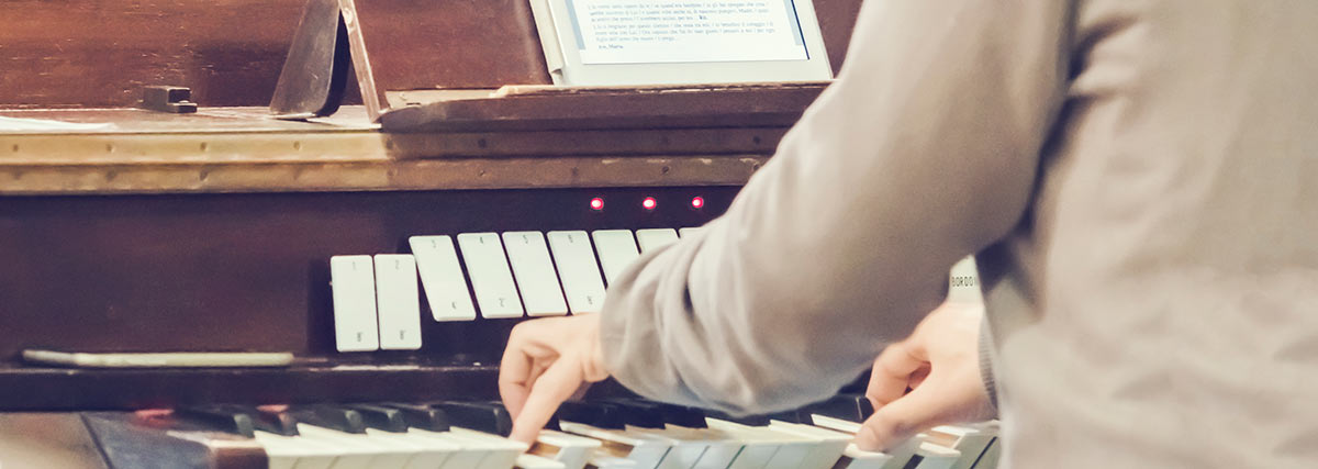 A man is playing on the organ