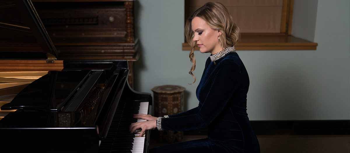 Beautiful woman playing piano