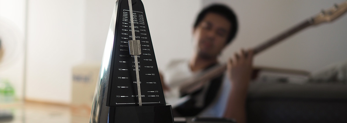 Black metronome is used by musician to help keep steady tempo