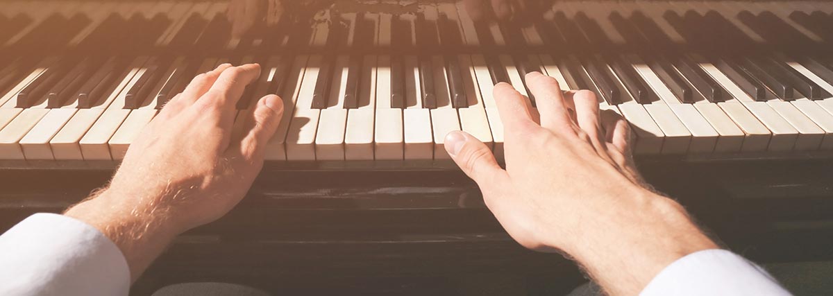 Close up hands on the piano