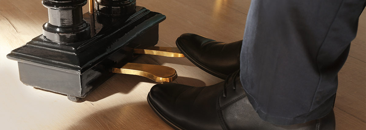 Foot on piano pedal