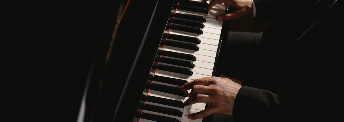 Hands of pianist on the keyboard