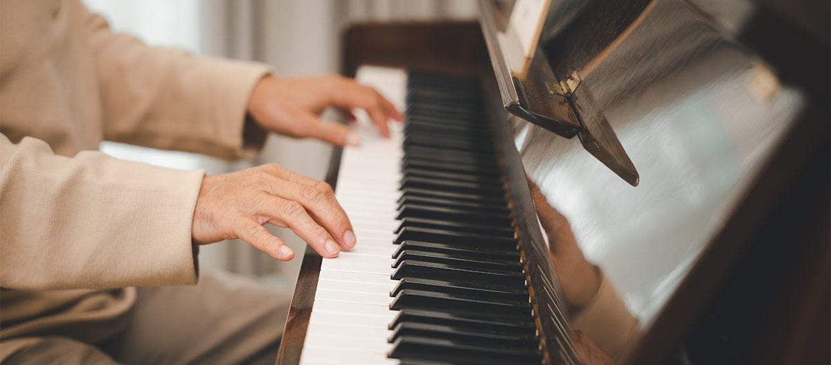 Hands playing piano