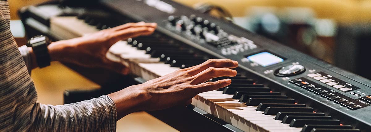 Hands playing piano