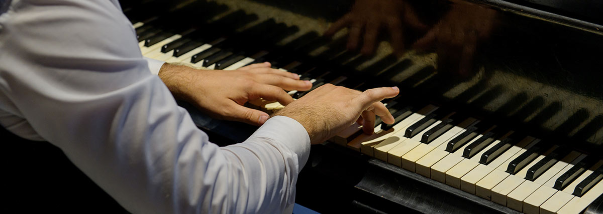 Hands playing piano