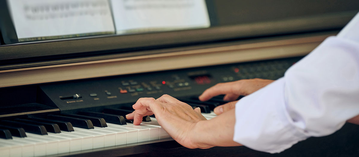 Hands playing piano