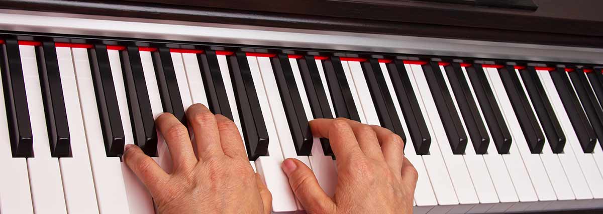 hands playing the piano