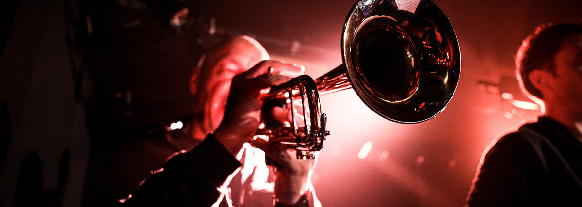 Jazz man playing trumpet during performance