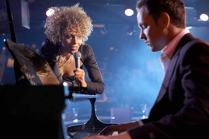 Jazz pianist performing with a singer