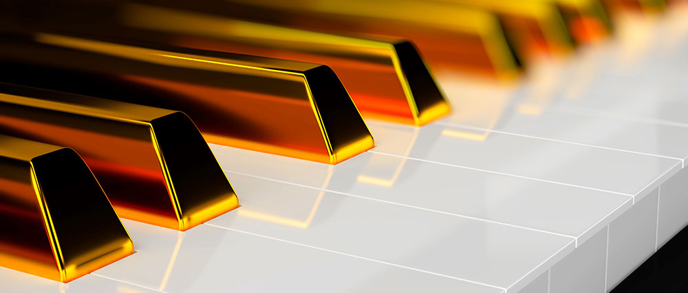 Keys of the piano in gold