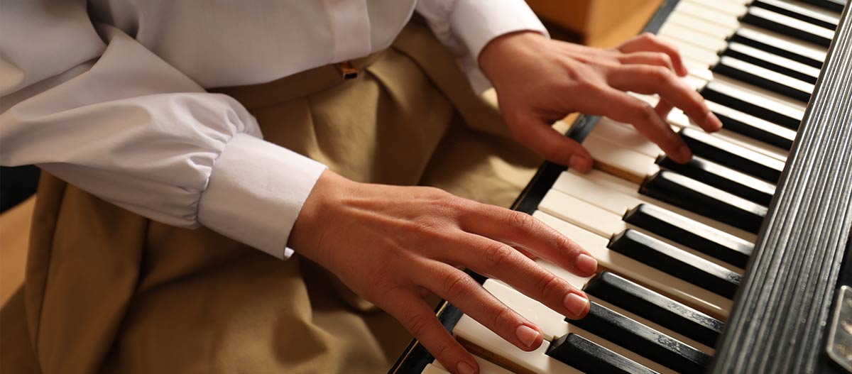 Lady hands playing piano