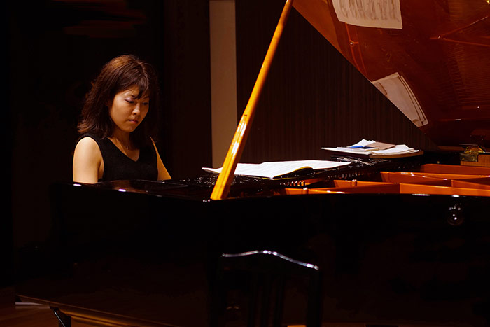 Lady learning classical piano