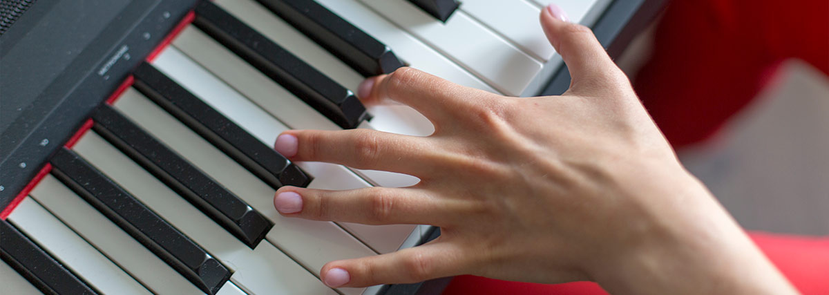 Left hand playing piano