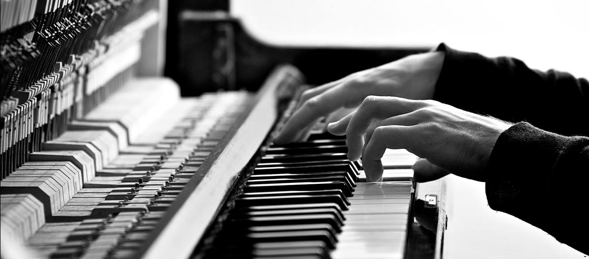 Male hands on piano keyboard