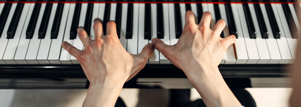 Male hands on the piano
