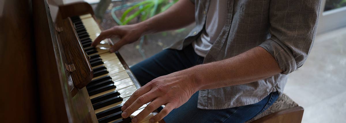 male hands playing the piano