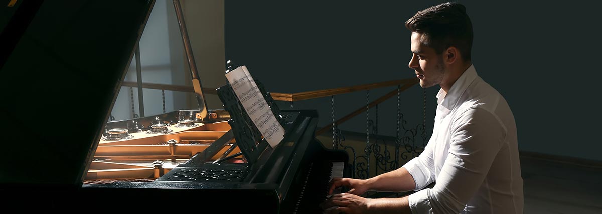 male pianist practising