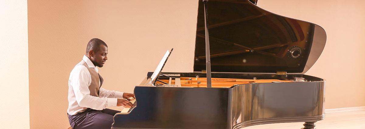 male pianist practising