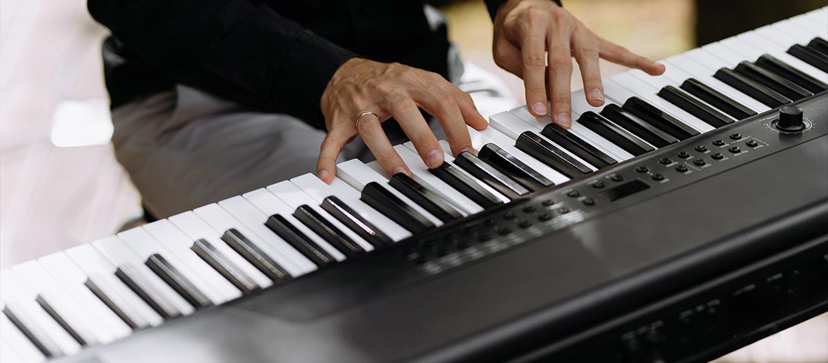 Man hands on piano keyboard