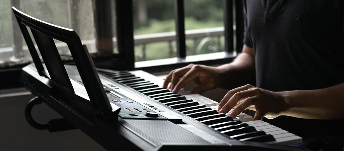 Man hands playing piano