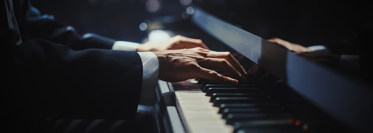 Man hands playing the piano