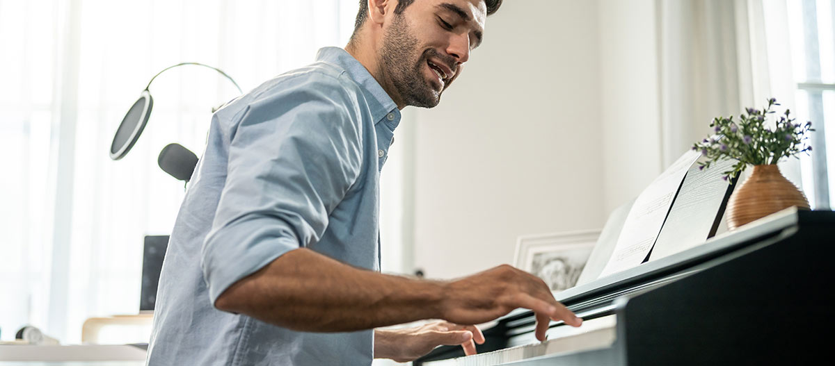 Man playing piano at home