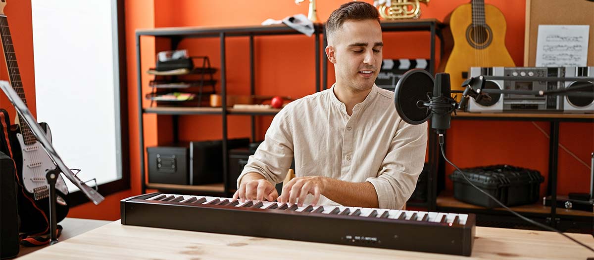 Man playing piano while singing