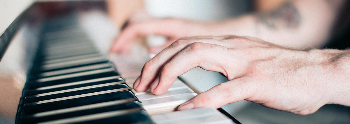 Man playing piano with both hands