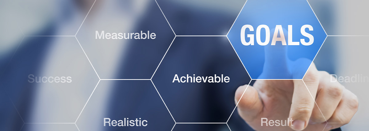 Man pointing at goal on the screen