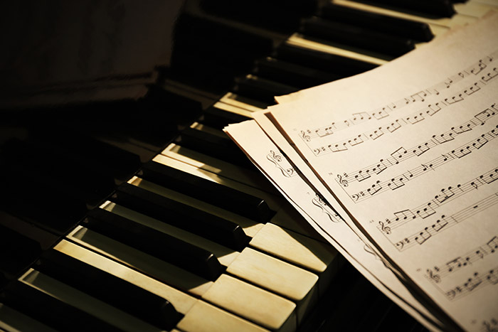 Old piano and music sheet feat