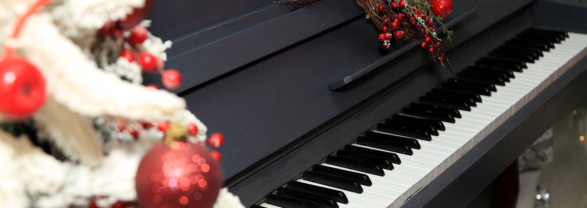 piano beside the Christmas tree