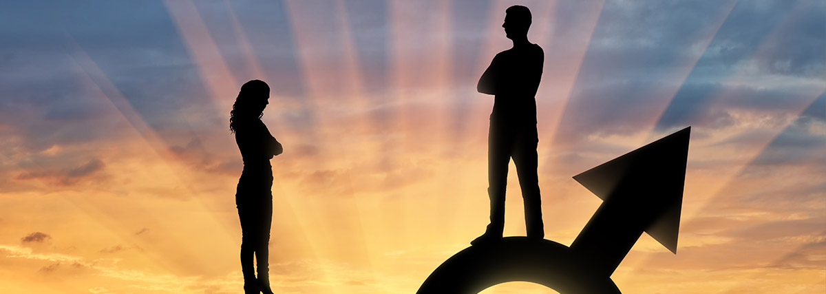 Silhouette of a big man and a small woman standing