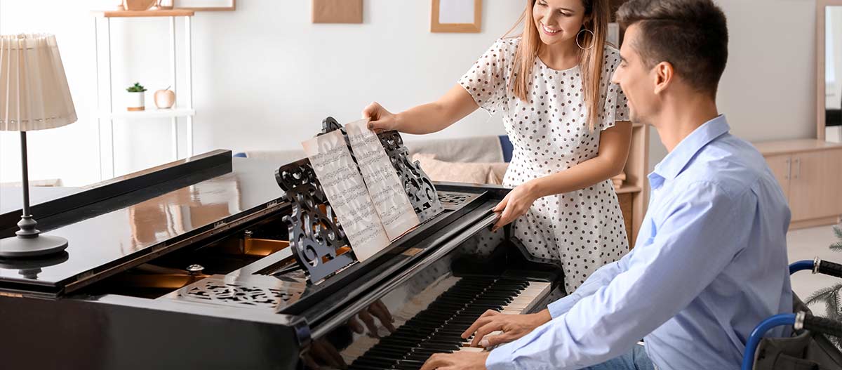 Teacher and student having piano lesson