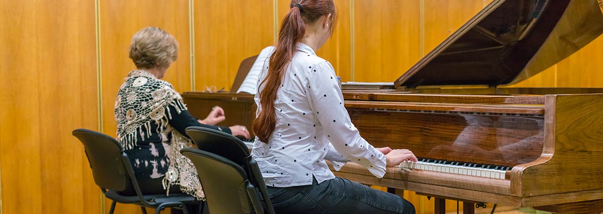 Two pianists practicing together