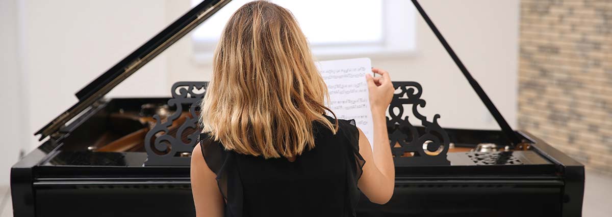 woman studying the piano