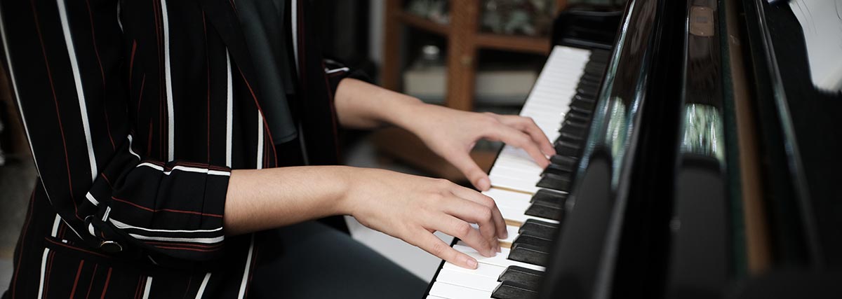 woman practising the piano