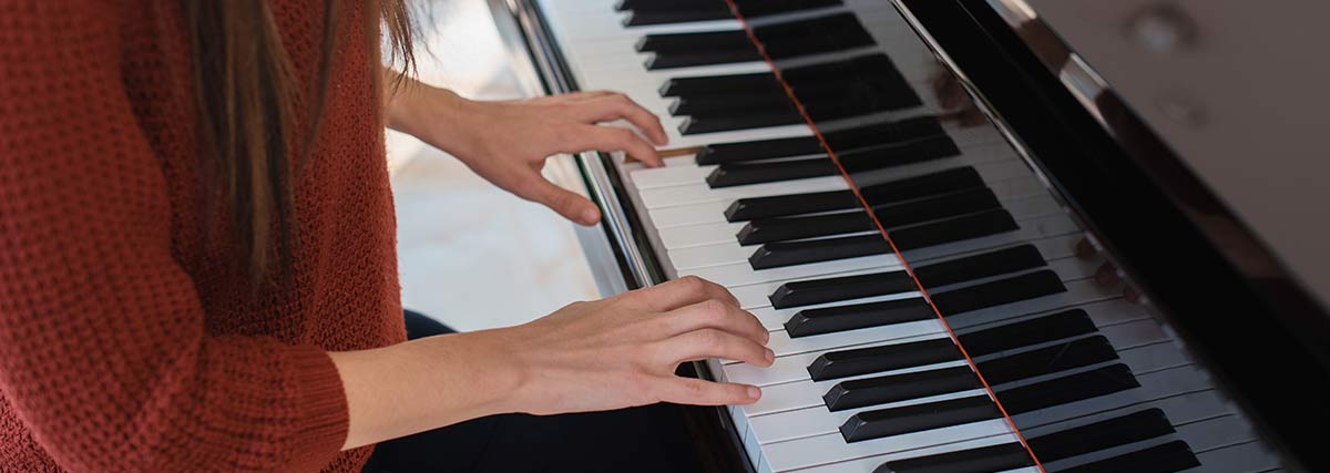 woman practising the piano