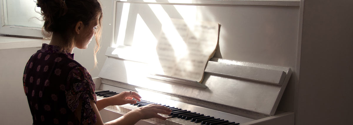 woman practising the piano