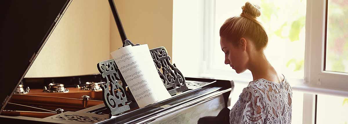 woman practising the piano
