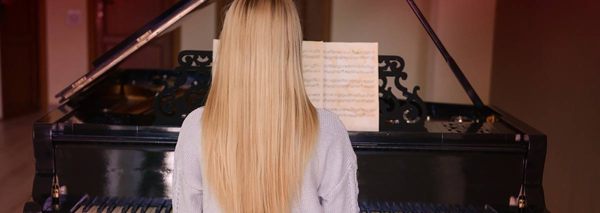 woman practising the piano