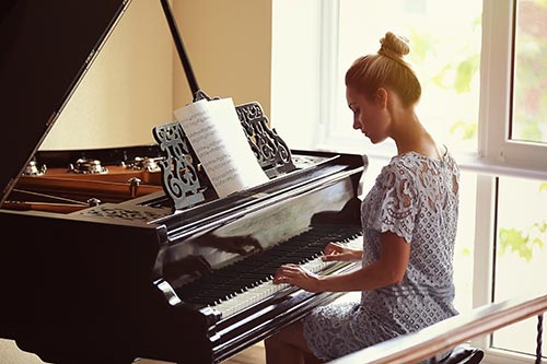 a woman performing the piano